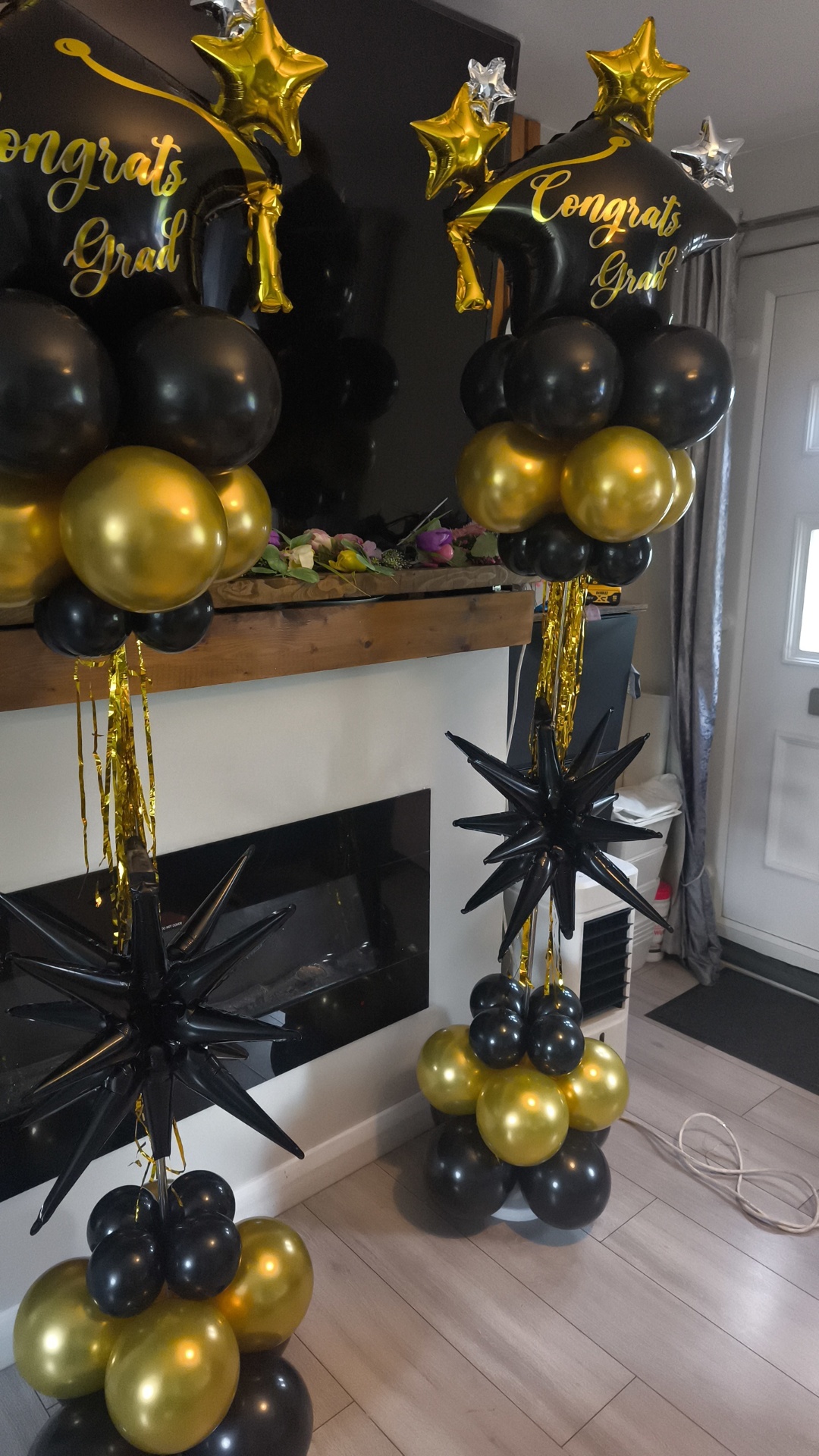 Congrats Grad — black & gold balloon columns