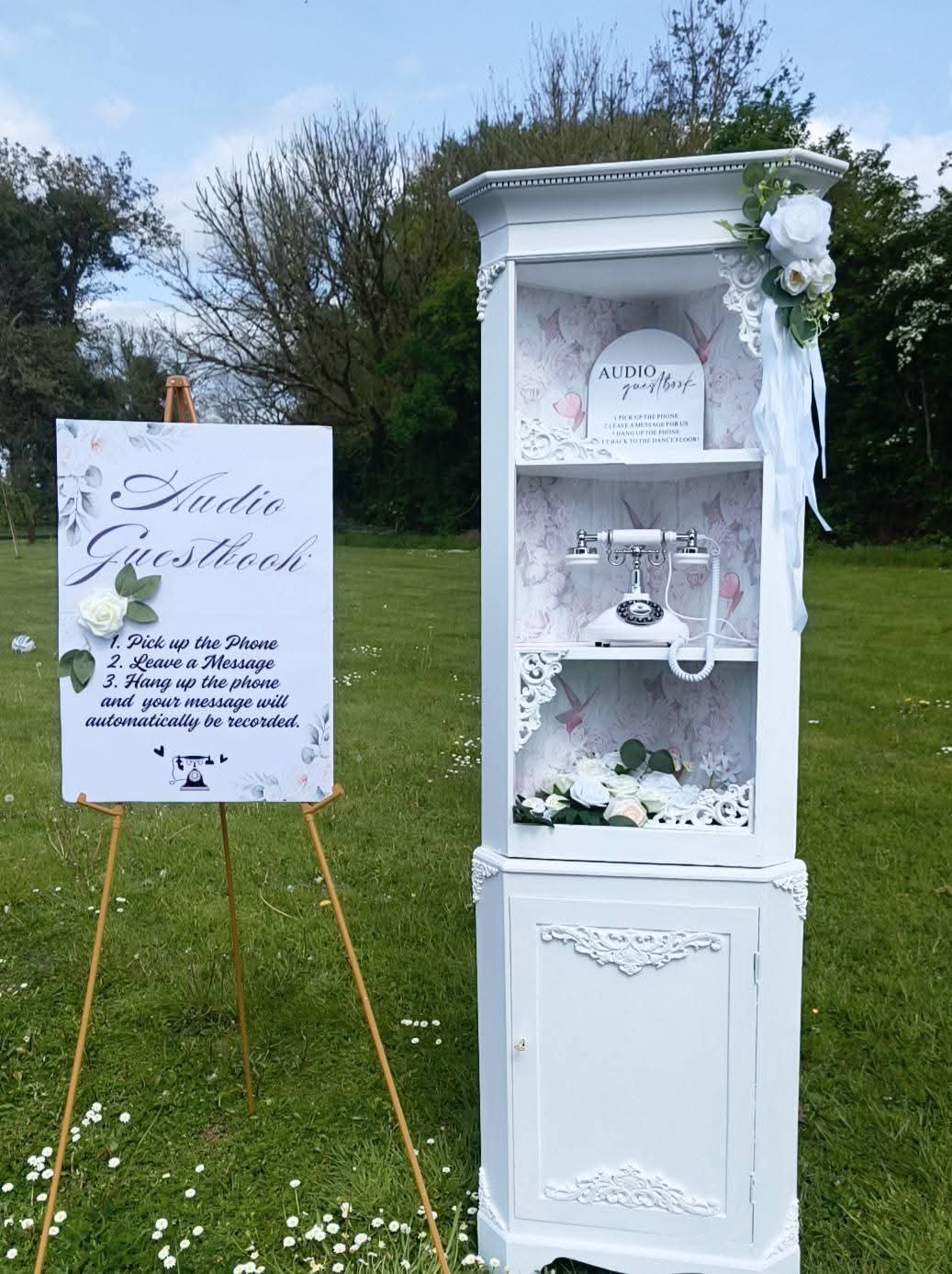 White cabinet audio guestbook display